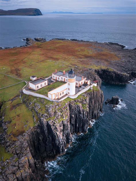 There is a beautiful triangular cliff stretching out into the atlantic ocean, and the lighthouse is still behind that cliff. Neist-Point-Lighthouse ⋆ We Dream of Travel Blog