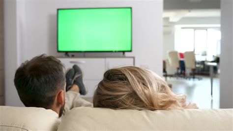 Couple On Couch Watching Tv Stock Video Motion Array