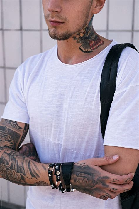 Close Up Of Young Man In White T Shirt With American Eagle Tattoo On