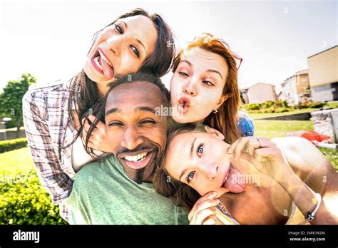 Happy Multiracial Friends Group Taking Selfie Sticking Tongue Out With