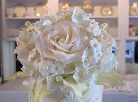 100 mini paper trays for pound cake, macarons with 100 cello bags. Close up of the sugar flower topper on the Floral & Lace ...