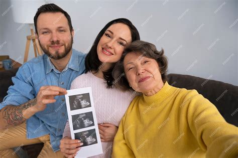 Free Photo | Medium shot happy family expecting baby