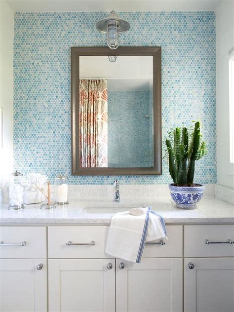 In This Coastal Inspired Bathroom A Handsome Framed Mirror Creates A