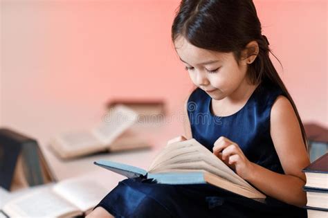 Cute Little Girl Is Reading A Book Stock Image Image Of Clever Book