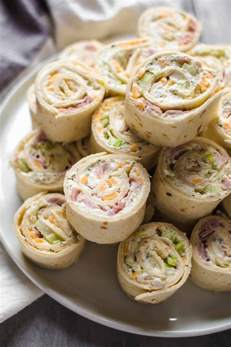 Once the cake is cool, unroll it and then spread with the cream cheese filling. Ham and Cheese Roll Ups (Tortilla Roll Ups) - VIDEO ...