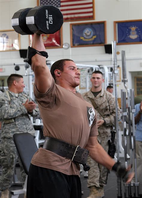 Navy Seaman Chris Spencer Lifts A 150 Pound Dumbbell Over His Head