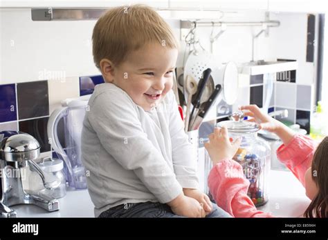 Child Reaches For Candy Jar Hi Res Stock Photography And Images Alamy