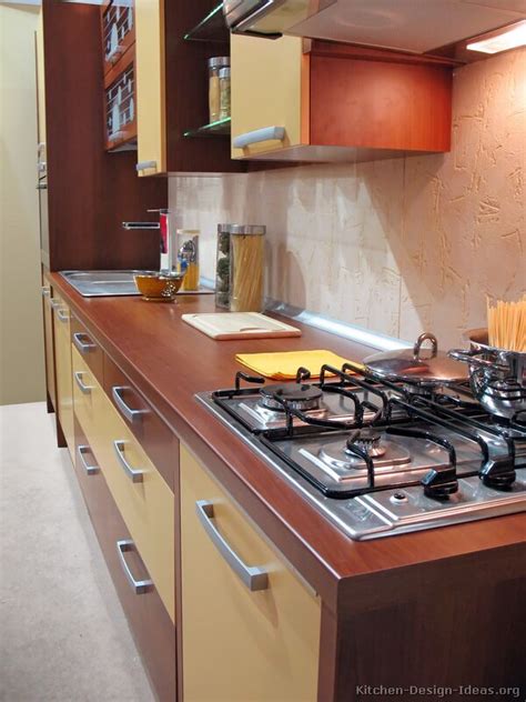 Strongly veined marble adds an organic presence to a room ruled by lines. Pictures of Modern Yellow Kitchens - Gallery & Design Ideas