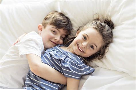 Brother And Sister Having Fun Together On Bed Stock Image Image Of
