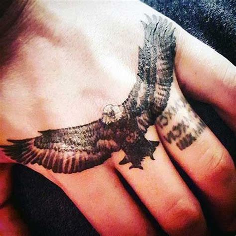An Eagle Tattoo On The Palm Of Someones Hand