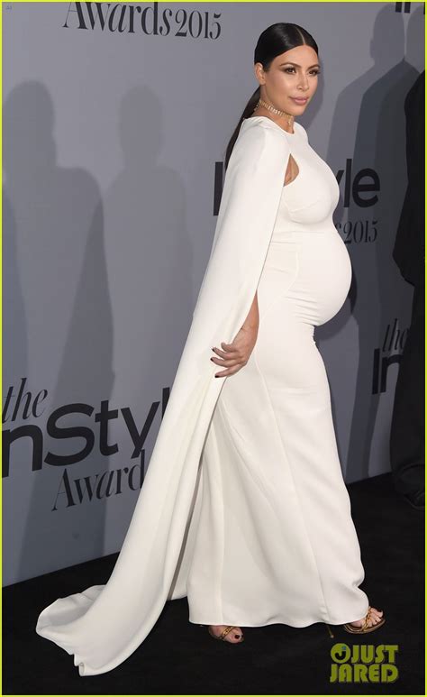 Pregnant Kim Kardashians Baby Bump Is Prominent In Form Fitting White