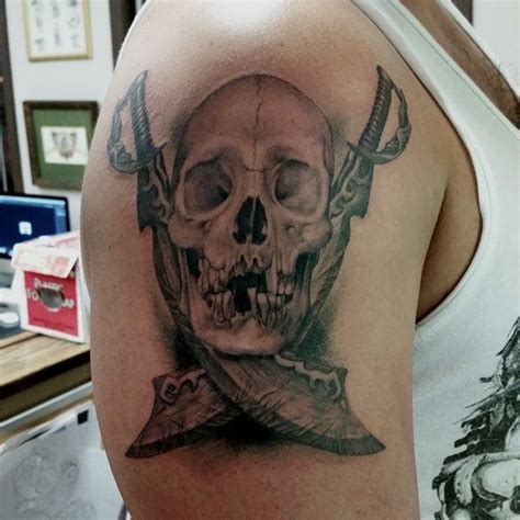 It can also have a more vicious meaning: A classic black and grey skull and cross swords tattoo ...