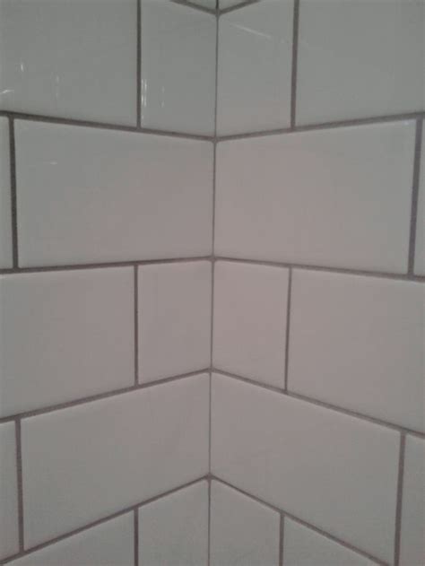 Looking to upgrade your home with the latest grey floor tiles? white subway tile with light grey grout | bathroom | Pinterest