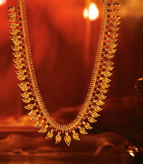 Tanishq Mangamalai With Ruby Studded Gold Mangoes Strung Together