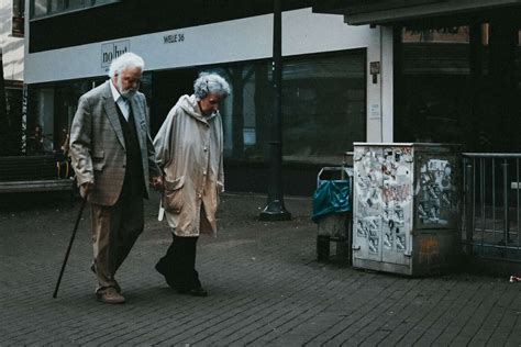 Old couple holding hands - No to Euthanasia - My CMS