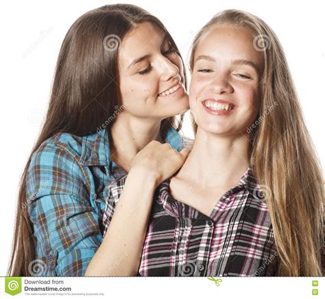 Two Cute Teenagers Having Fun Together Isolated On White Stock Photo