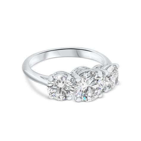 Tiffany diamonds are brighter and more vibrant because we craft them that way. Tiffany and Co. Three-Stone Diamond GIA Certified Platinum Engagement Ring For Sale at 1stDibs