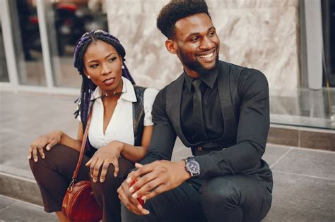 Free Photo A Stylish And Beautiful Dark Skinned Couple In A City