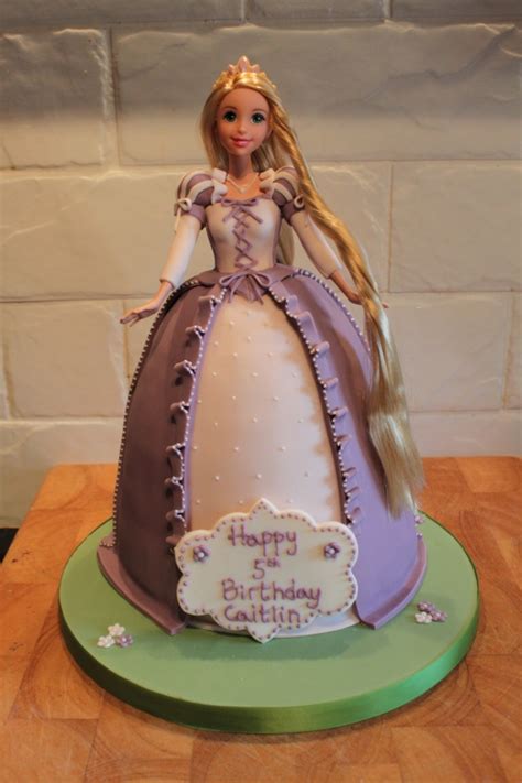 Wooden cake cake woman birthday birthday 18 birthday party happy birthday cake happy birthday princess crown cake decorated with flowers young african american girl birthday party happy woman with cake candle 30. Rapunzel Cakes - Decoration Ideas | Little Birthday Cakes