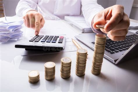 Business Person Counting Coins Using Calculator Stock Photo Image Of