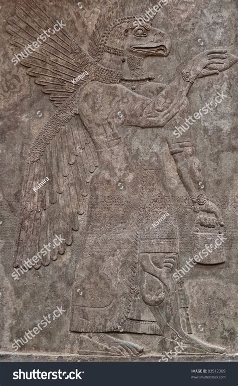 Ancient Assyrian Clay Relief Depicting An Eagle Faced God And Text