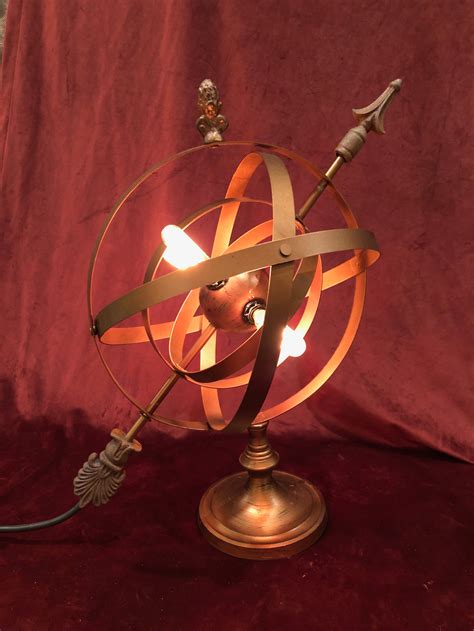 Striking Armillary globe with warm Edison bulb lighting, adjustable ...