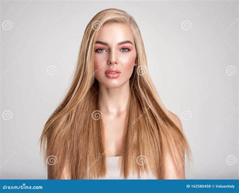 Portrait Of A Blonde Beautiful Woman With A Long Straight Light Hair