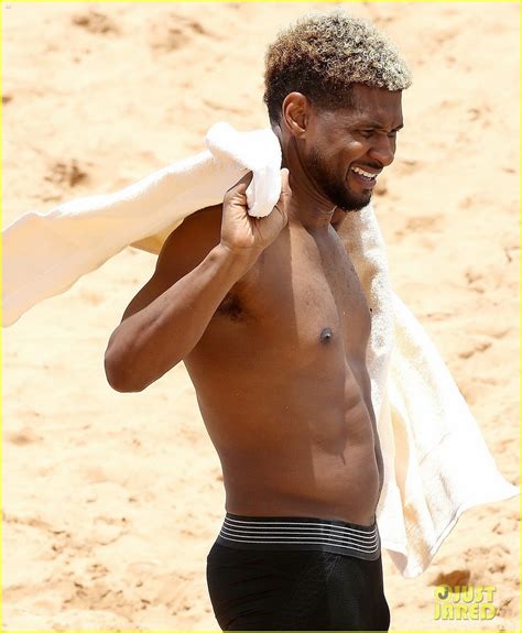 Usher Stays Clothed While Paddle Boarding Goes Shirtless On The Beach