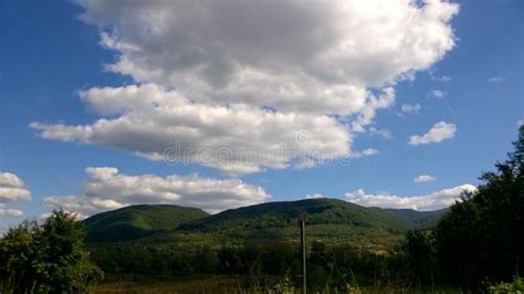 White Cumulus Clouds Over Green Mountains Stock Photo Image Of Alps