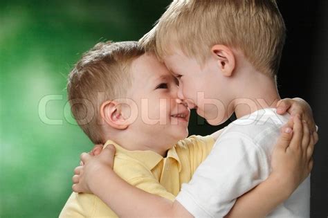 Portrait Of Two Little Boys With A Smile On The Face Stock Photo