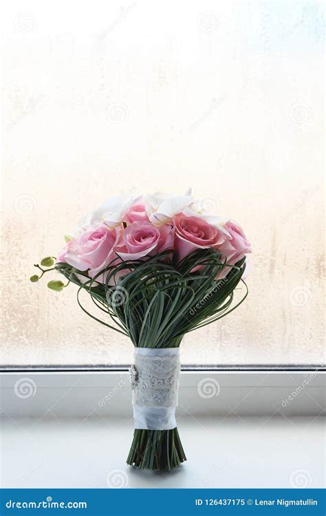 Wedding Bouquet Made Of White Roses And Lily On The Window Sill Stock