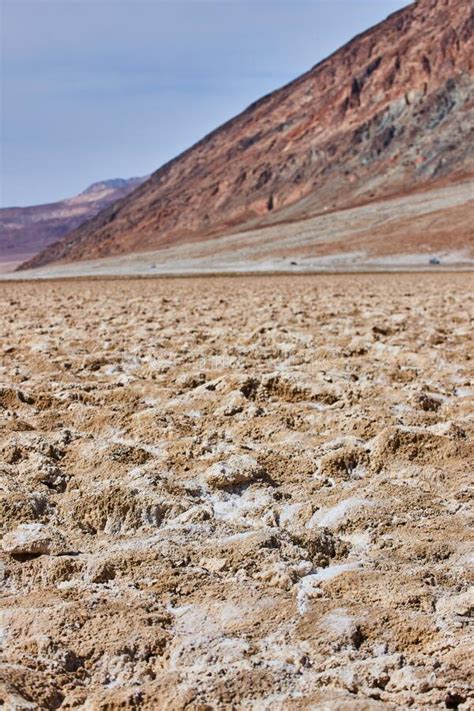 California Death Valley Salt Flats In Detail By Mountains Stock Photo