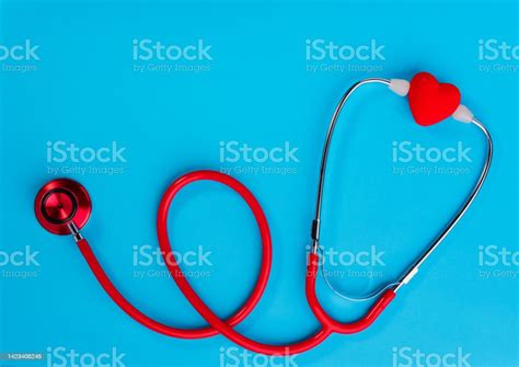 Red Heart And Stethoscope On On Blue Background Stock Photo Download
