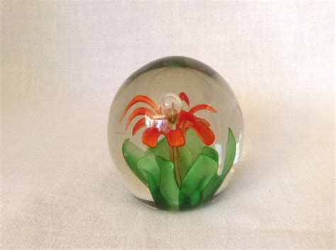 Beautiful Hand Blown Glass Paperweight With Orange Blossom And