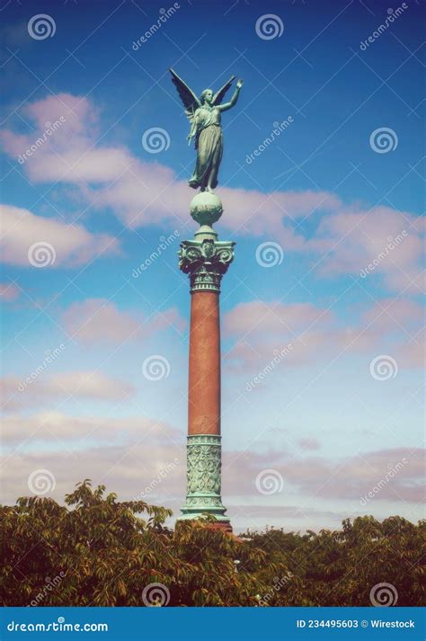 Angel Statue Of Ivar Huitfeldt Column Against A Cloudy Blue Sky In