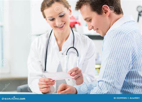 Doctor With Patient In Clinic Consulting Stock Image Image Of