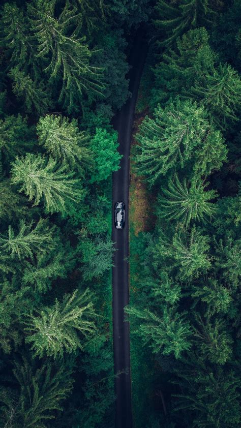 Download Wallpaper 1080x1920 Aerial View Car Trees Forest Samsung