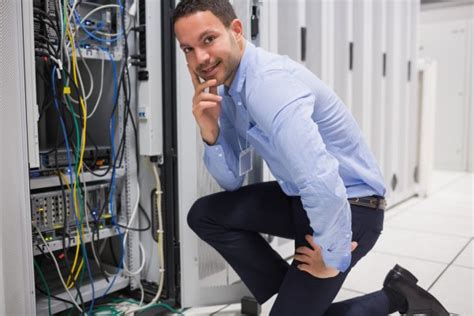 Smiling Man Checking The Servers Stock Image Everypixel