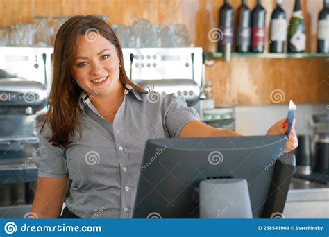 waiter girl working with pos terminal or cashbox at cafe people and service concept stock image