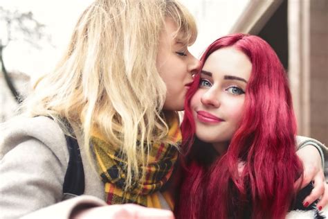 Premium Photo Blonde Lesbian Kissing Forehead Of Her Loving Girlfriend With Pink Hair Gentle