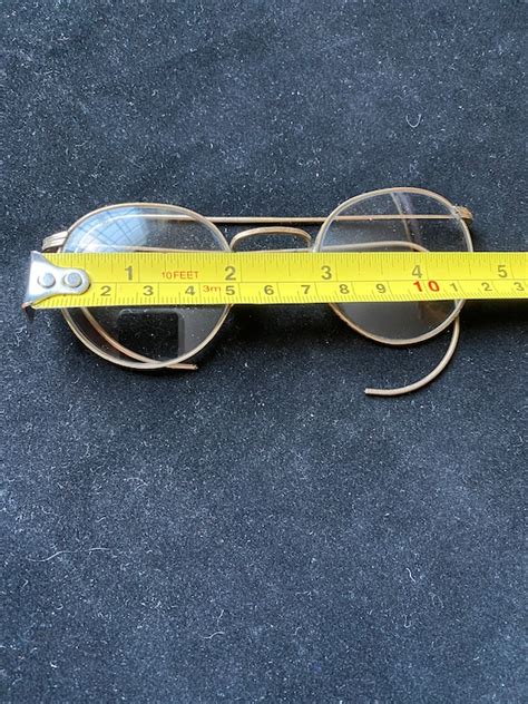 old pair of round gold ful vue vintage eyeglasses gem