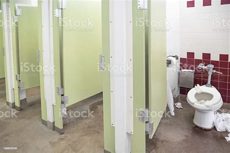 Public Bathroom Stalls And One Very Dirty Toilet Stock Photo Download