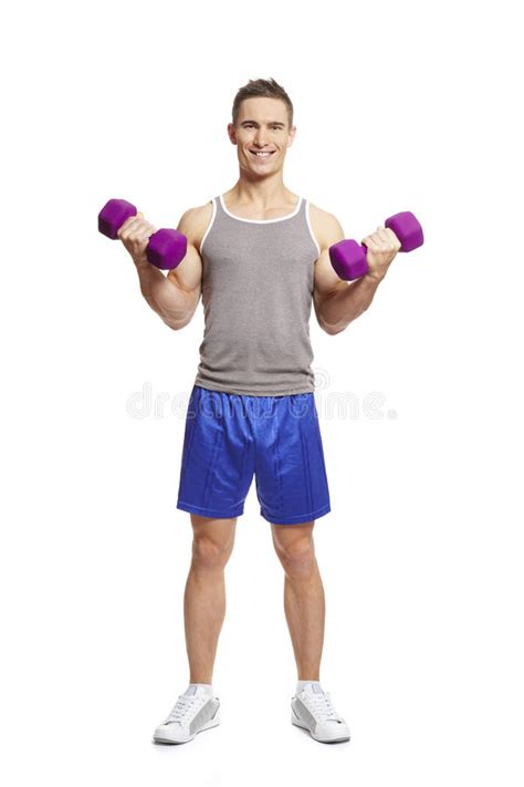 Muscular Young Man Flexing Arm Muscles In Sports Outfit Stock Photo