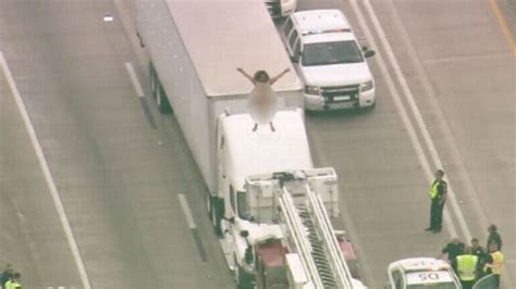 Naked Woman Brings Traffic To Standstill As She Climbs Up On Lorry To