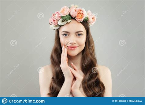 Smiling Spa Woman With Clear Skin Long Hair And Flowers Stock Photo