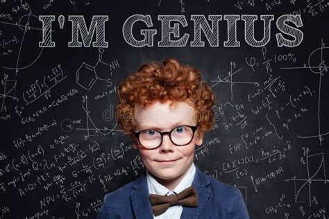 Genius Child On Blackboard Background With Science And Maths Formulas