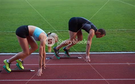 Athlete Woman Group Running On Athletics Race Track On Soccer Stadium