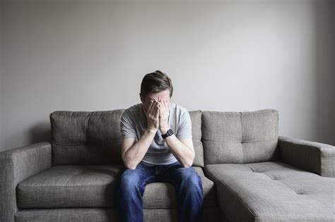 Depressed Mature Man Sitting On Couch Hancock Regional Hospital