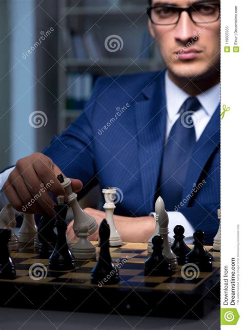 The Businessman Playing Chess In Strategy Concept Stock Photo Image