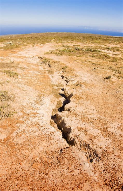 The tectonic forces at work within the rocks create large faults resulting in the release of energy that consequently leads to the eruption of volcanoes and earthquakes. Potential California earthquake fault line exposed on the ...